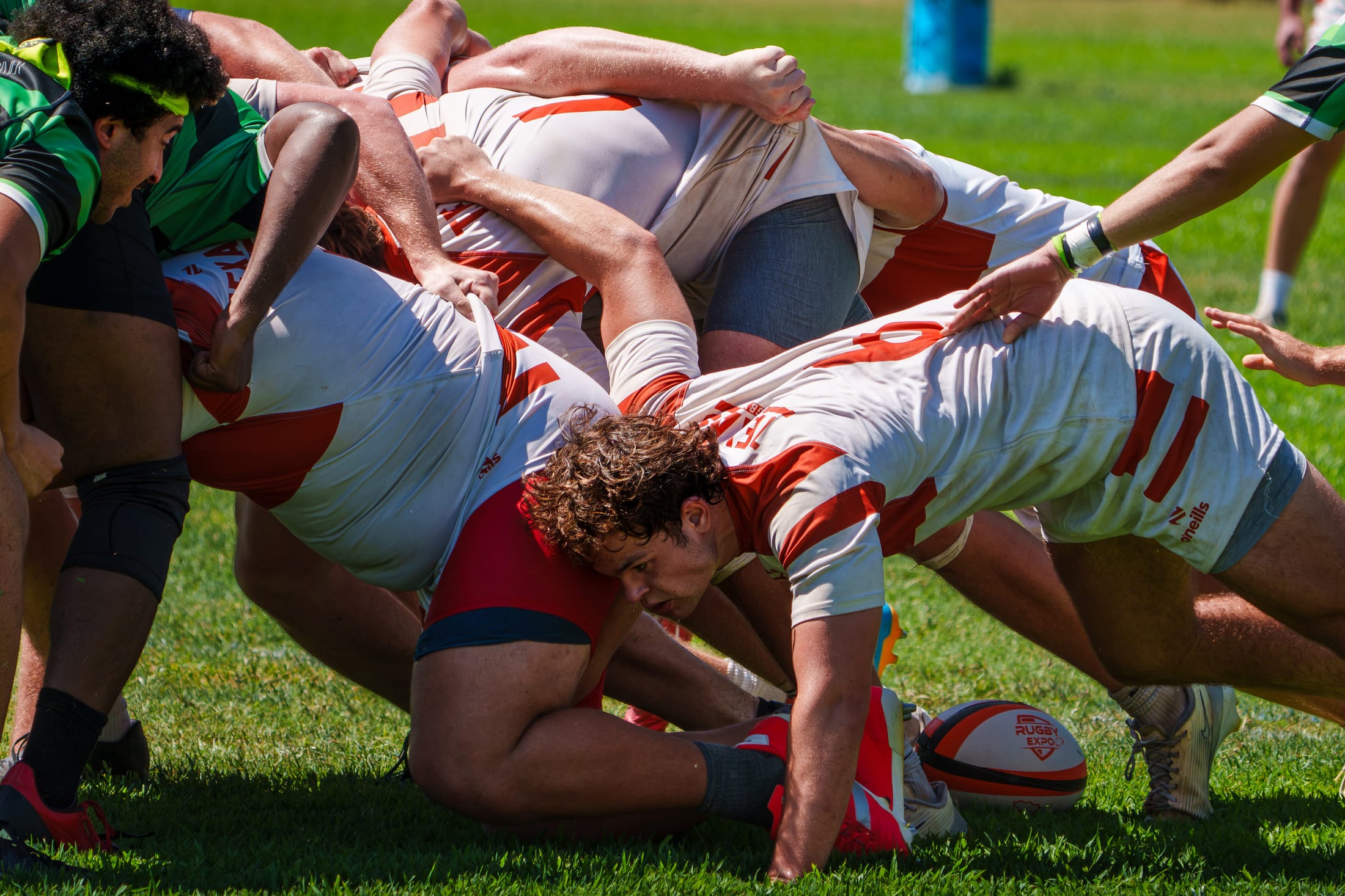 Rugby players locked in a scrum