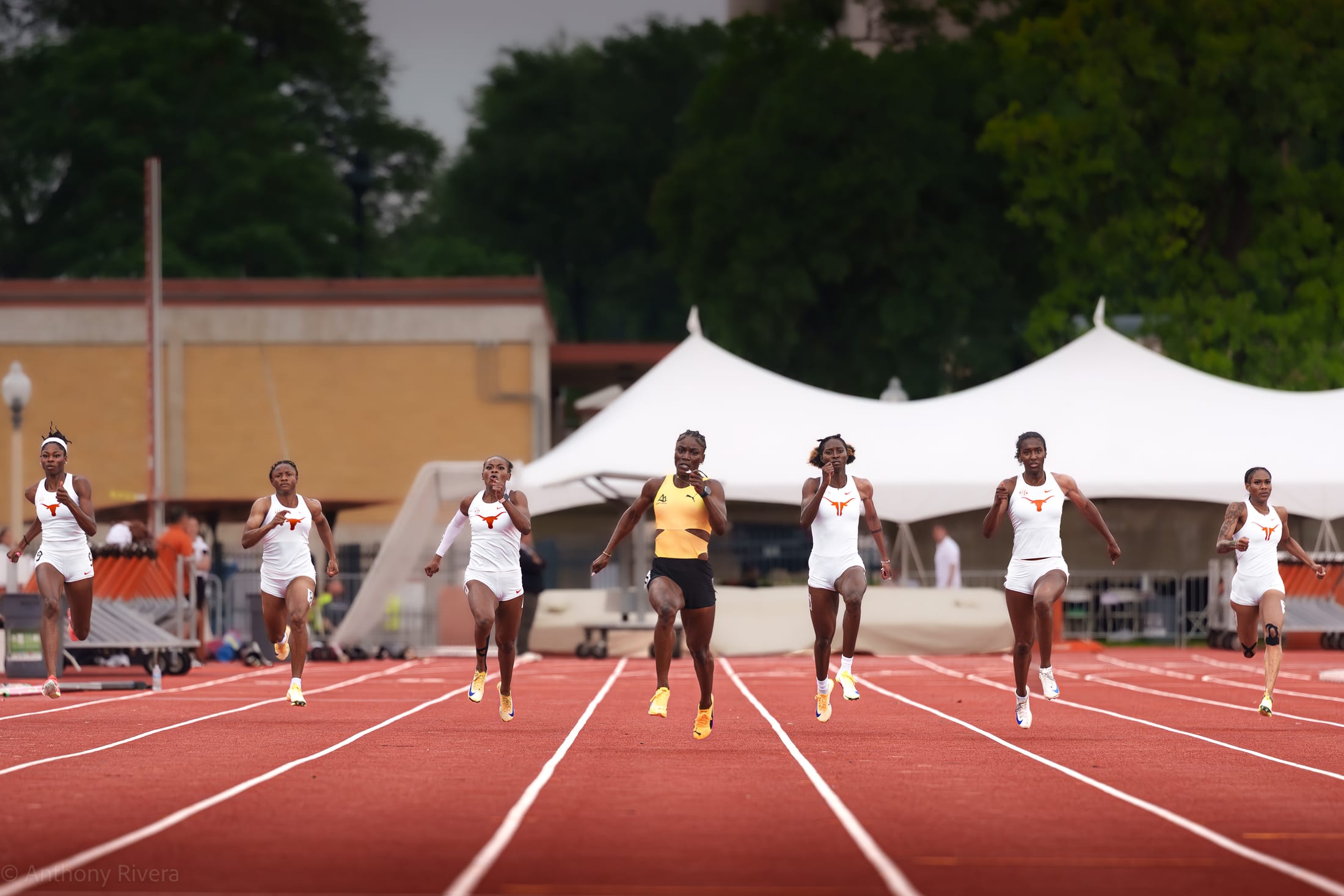 Sprinters racing down the track at a Texas meet